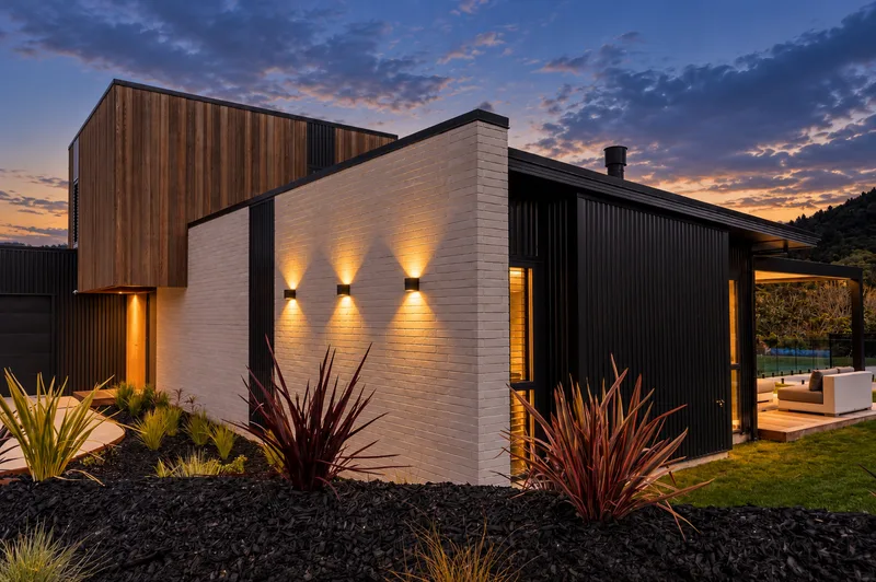 Wall lights at dusk, Cedar Cube House